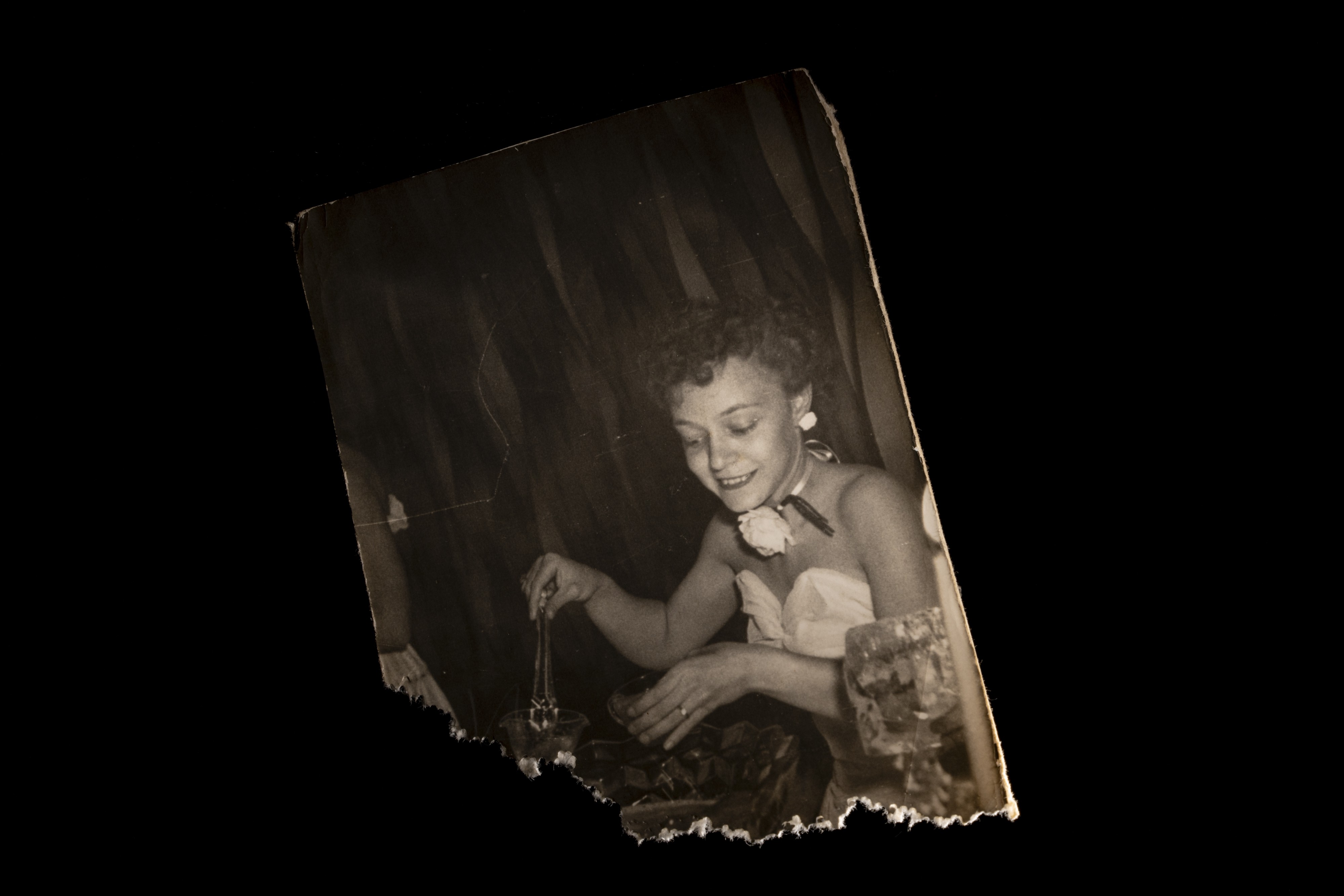 A photograph of Joann Ray Blake scooping punch on her wedding day, from a photo found in a box in her bedroom.